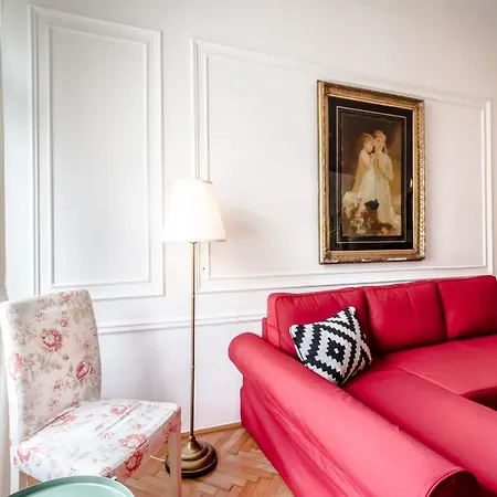 Golden Esthetic With Red Sofa