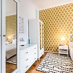 Apartman Golden Esthetic With Red Sofa